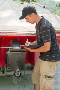 Mechanic checking boat by Canva | Smart Boater | Marinalife