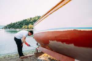 Man painting his boat by AegeanBlue | nautical diy | marinalife